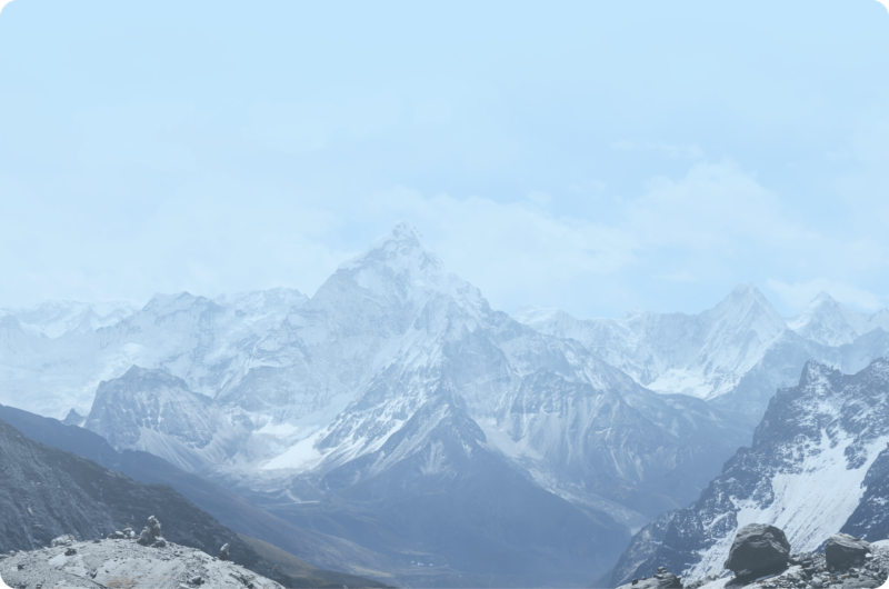 Snow-covered mountains beneath clear blue skies