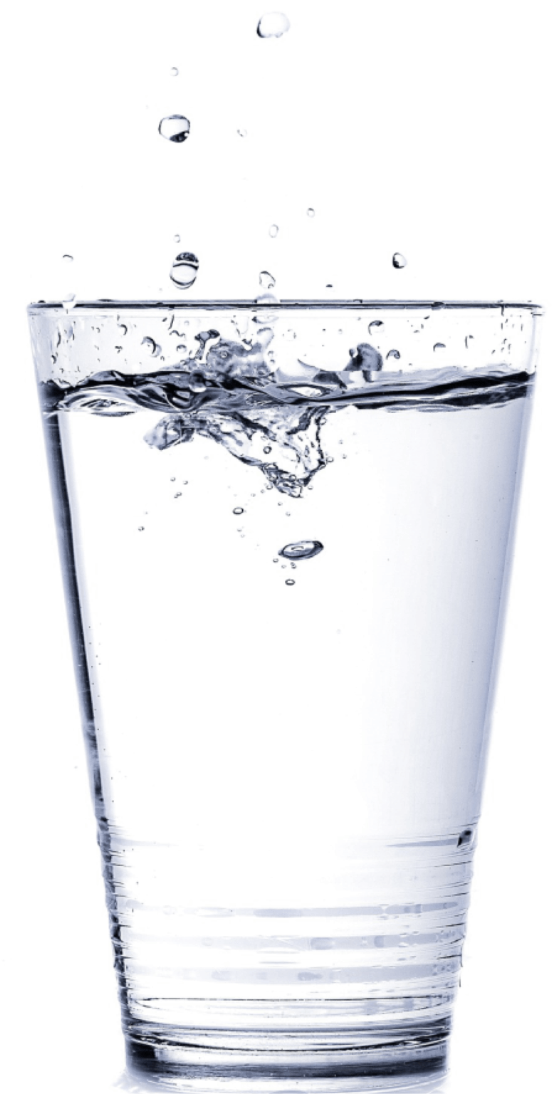 A clear glass of fresh water with splashing droplets